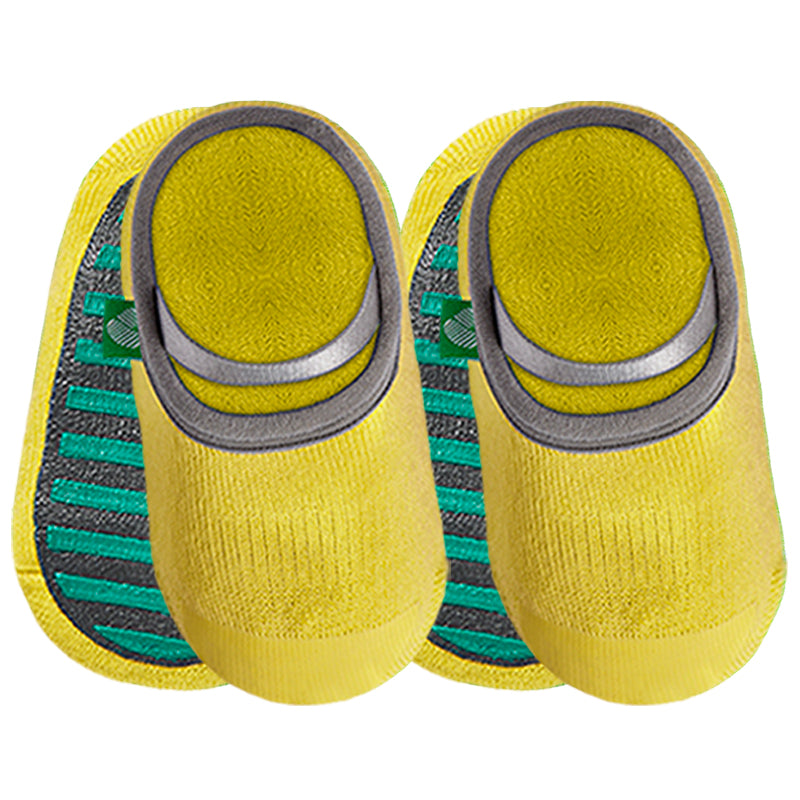 Yellow baby socks with non-slip sole on white background